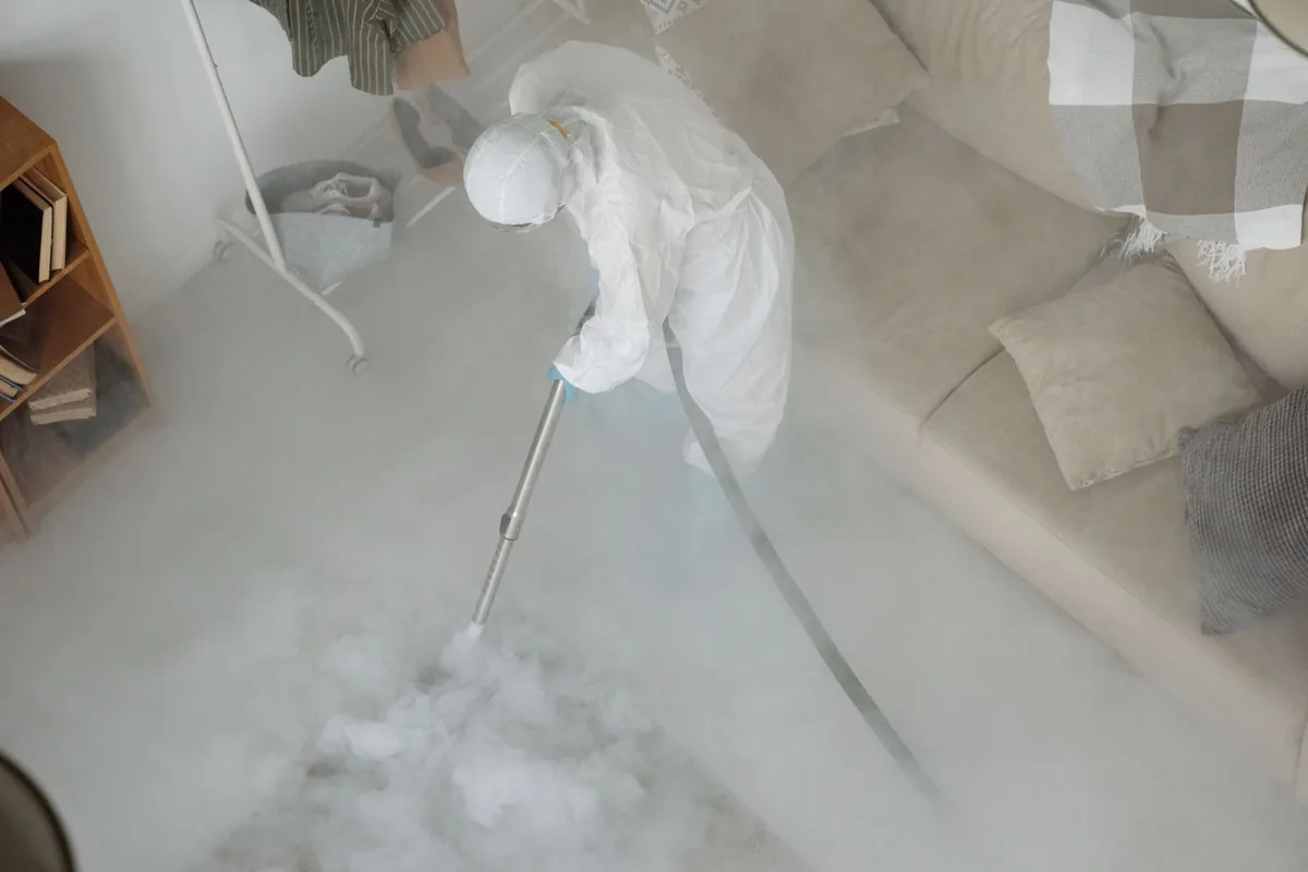 Biohazard cleanup technician in protective equipment, Warsaw, KY